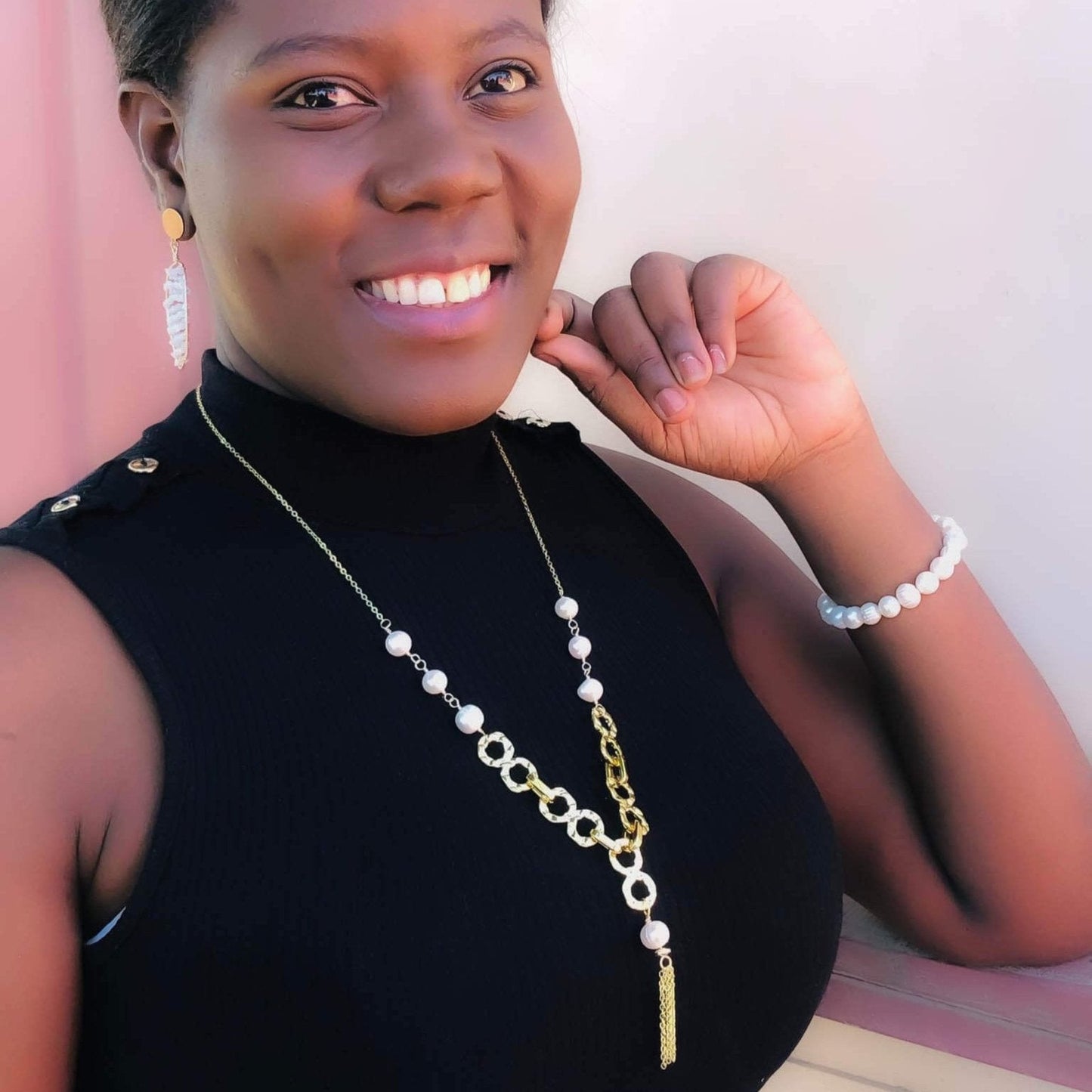 Empowering pearl and gold chain y necklace with tassel detail