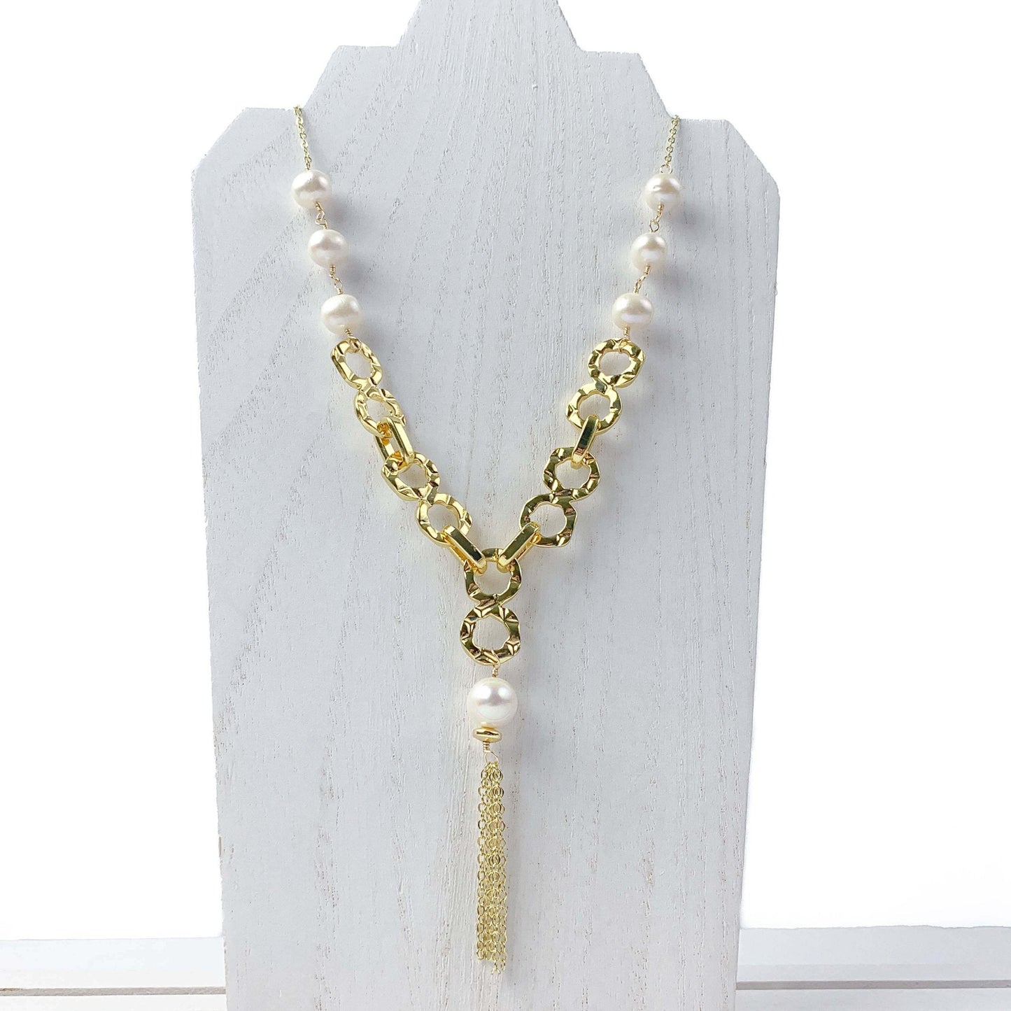 Empowering pearl and gold chain y necklace with tassel detail