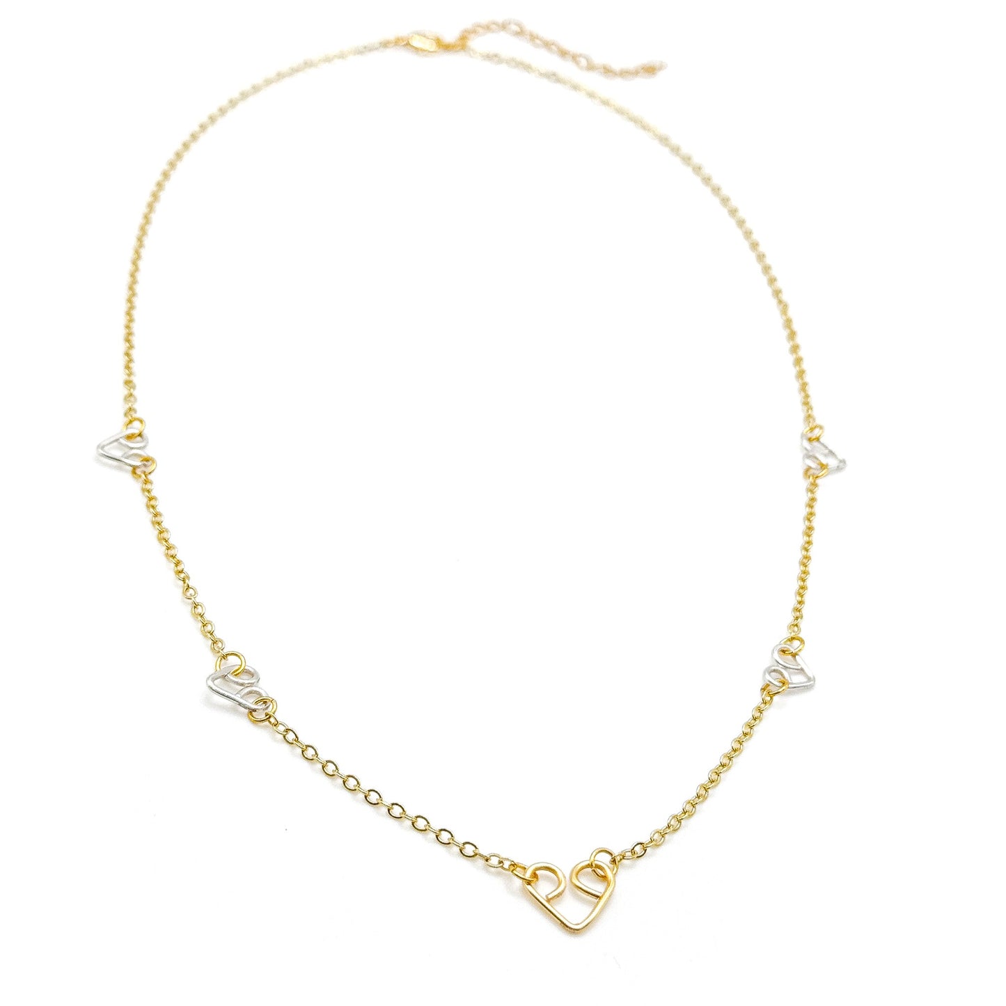 Intertwined gold and silver two-tone heart necklace